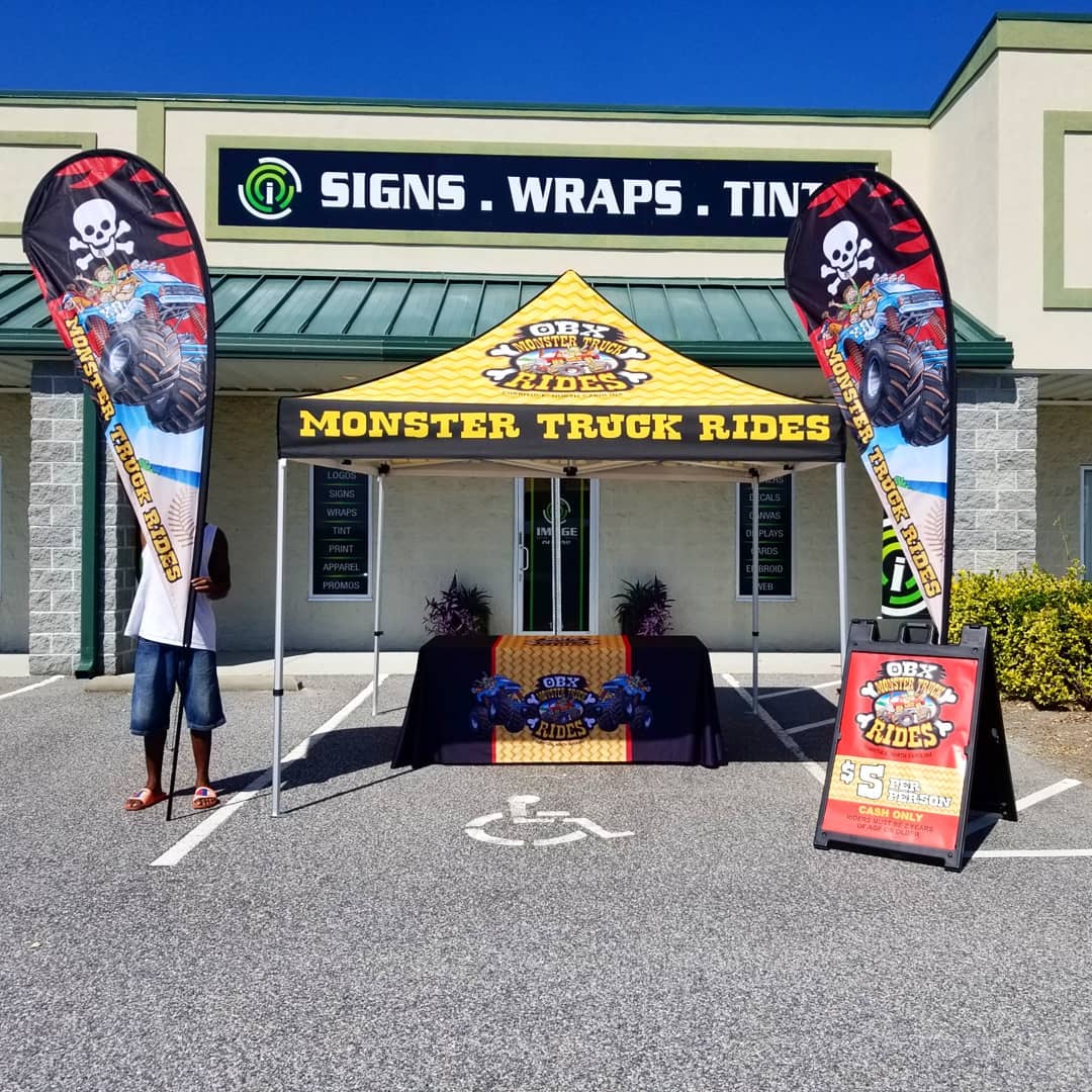 OBX Monster Truck Rides tent and flags